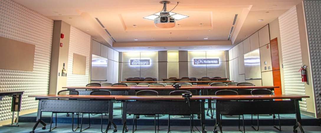 First-floor auditorium with tiered desks and projection equipment