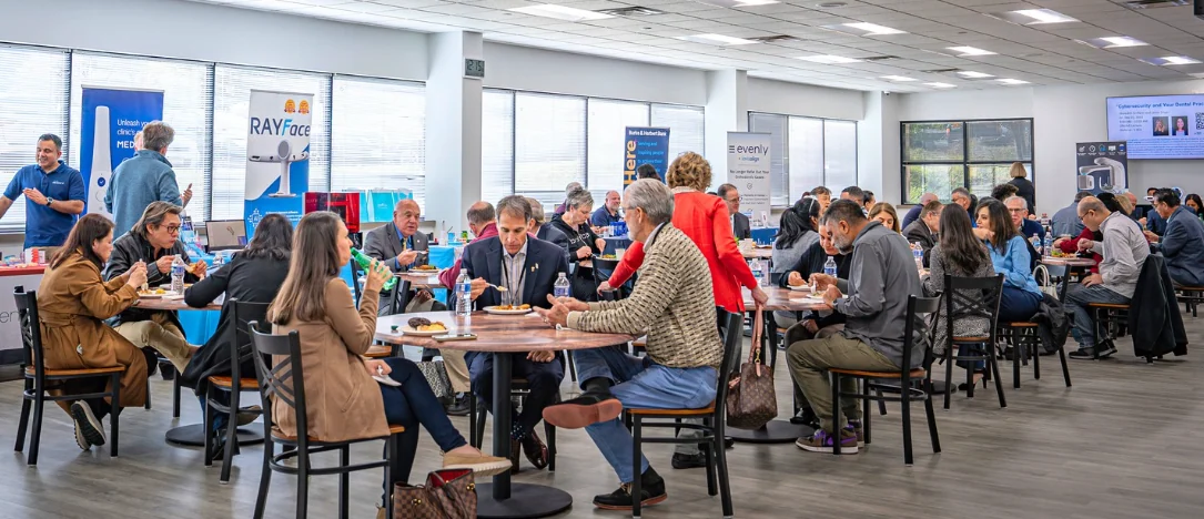 Attendees dining and networking in the first-floor dining hall